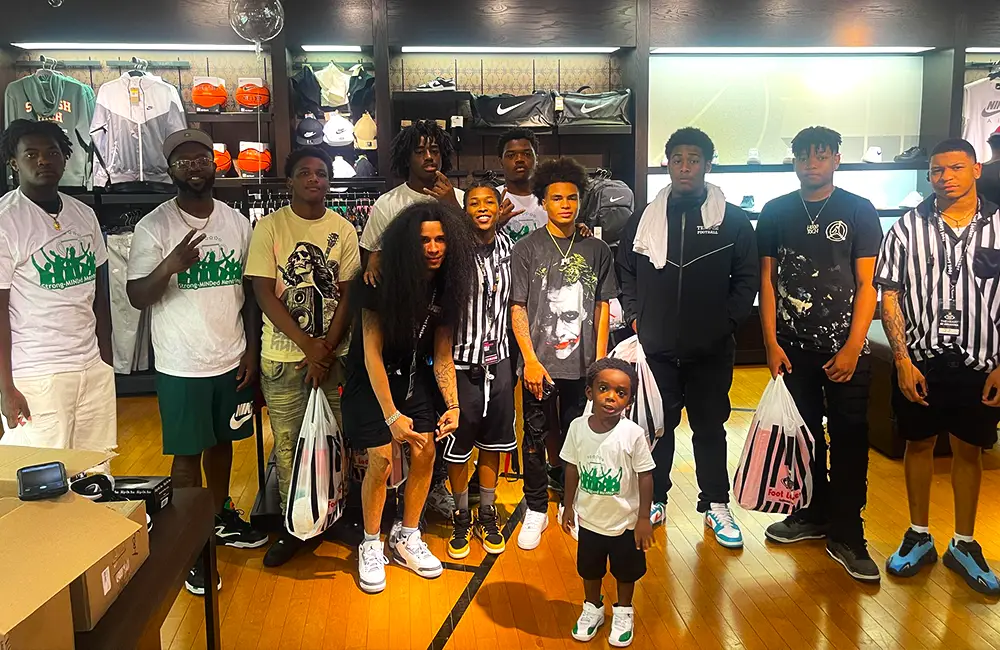 Youth participants at community basketball clinic in local gym facility